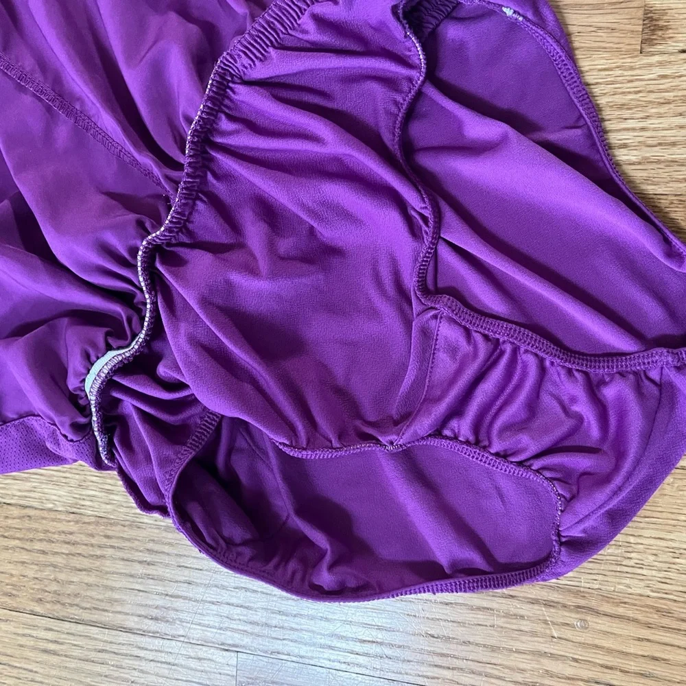 Women’s purple Dri-Fit Nike running shorts with animal print
